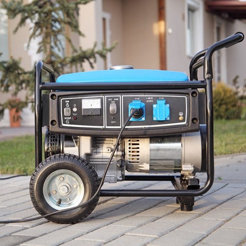 Gasoline powered portable generator at home.