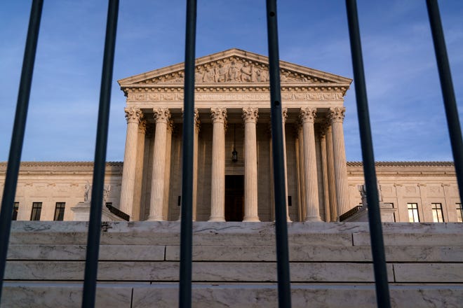 In this Nov. 5, 2020, file photo, the Supreme Court in Washington. The Supreme Court has rejected Republicans' last-gasp bid to reverse Pennsylvania's certification of President-elect Joe Biden's victory in the electoral battleground. The court without comment Tuesday, Dec. 8, refused to call into question the certification process in Pennsylvania.