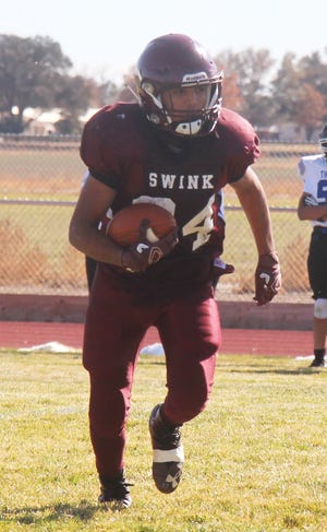 Swink High School's Matthew Mendoza runs with the ball in a game against Denver Christian this season. The Lions won five games and lost one in 2020.