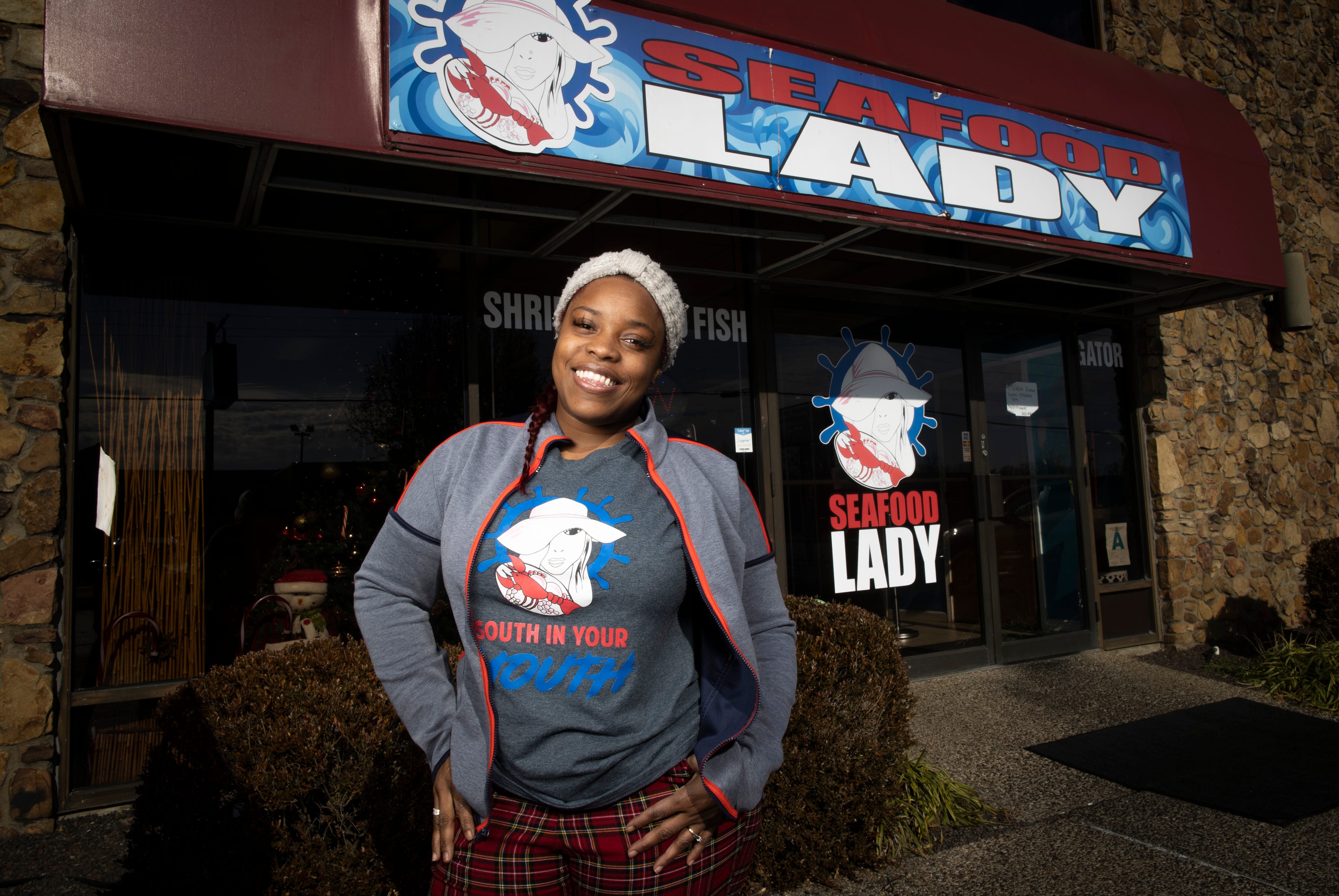 Nichelle Thurston, owner of the Seafood Lady in Louisville, stands outside her popular restaurant on Fern Valley Road. Dec. 11, 2020