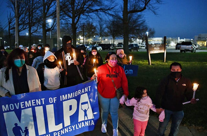 Around two dozen gather for the "Free Our Loved Ones" vigil held outside York County Prison in Springettsbury Township, on Human Rights Day, Thursday, Dec. 10, 2020. Organizations including MILPA (Movement of Immigrant Leaders in Pennsylvania), New Sanctuary Movement of Philadelphia, VietLead and Juntos, based in Philadelphia, hosted the event urging officials to release those being detained by federal Immigration and Customs Enforcement (ICE) at the York Detention Center, in light of the COVID-19 pandemic. Dawn J. Sagert photo