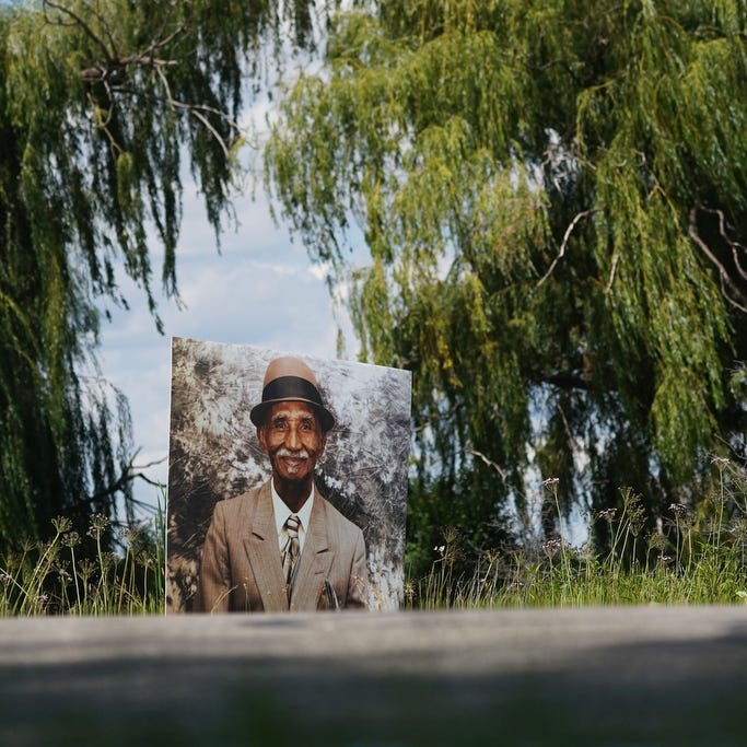 A photo of the late Anthony George Wright Sr. is on display amongst photos of Detroit residents and people with connections to Detroit who died during the pandemic as part of the Memorial Drive on Belle Isle in Detroit, Michigan on Monday, August 31, 2020.