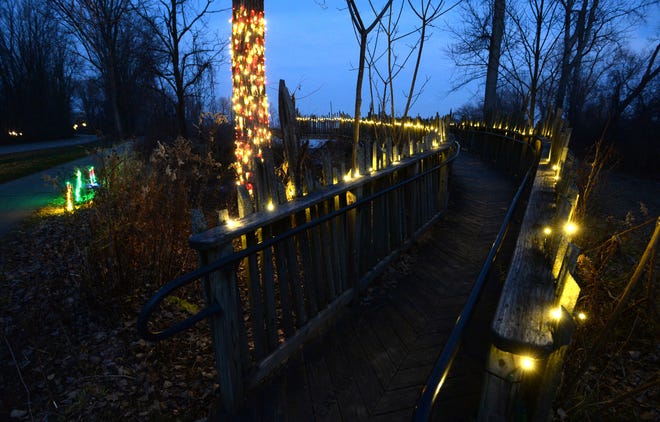 Holiday lights decorate "The Feather" at Leo's Landing at Presque Isle State Park on Dec 11, 2020, during the Presque Isle Lights event.