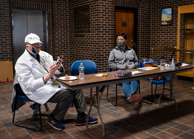 Worcester Medical Director Dr. Michael Hirsh, co-founder of the Goods for Guns Buyback, and UMass Memorial Health Injury Prevention Coordinator Asia Simpson, wait for people at the Police Department during last year's buyback program.