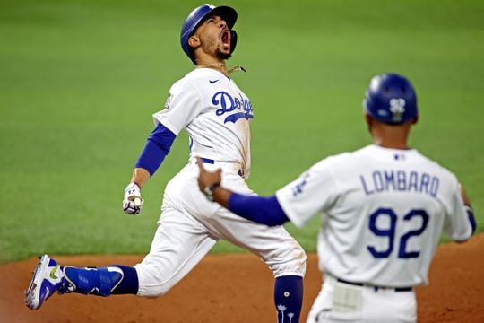 Oct. 27: Los Angeles Dodgers right fielder Mookie Betts celebrates after hitting a home run during the eighth inning of Game 6 of the World Series against the Tampa Bay Rays.