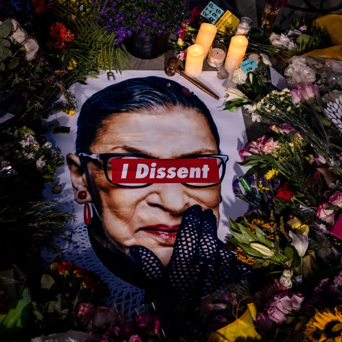 People left mementos in a makeshift memorial for Supreme Court Justice Ruth Bader Ginsburg in front of the US Supreme Court on September 19, 2020 in Washington, DC.