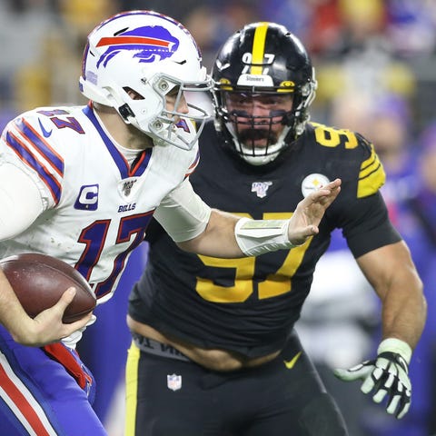 Buffalo Bills quarterback Josh Allen runs the ball