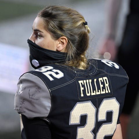 Vanderbilt place kicker Sarah Fuller (32) watches 