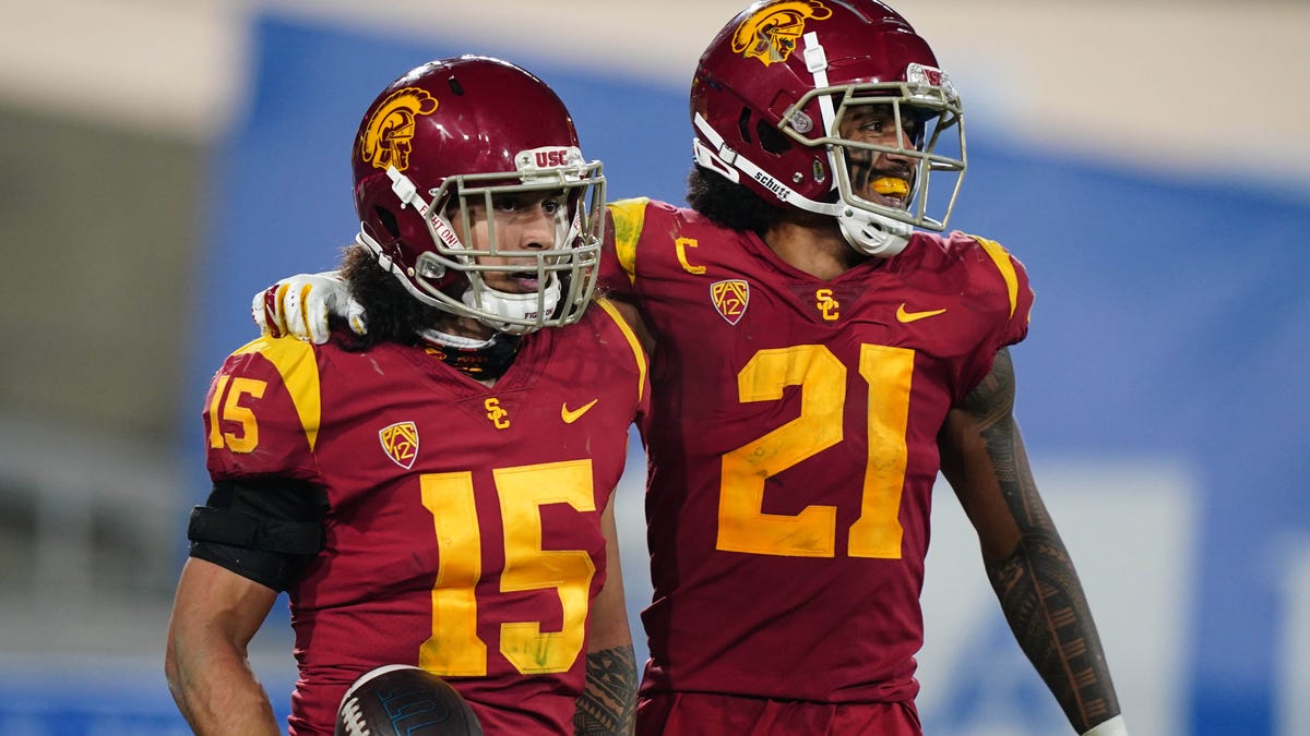 USC safety Talanoa Hufanga (15) celebrates with safety Isaiah Pola-Mao after an interception in the fourth quarter against UCLA.