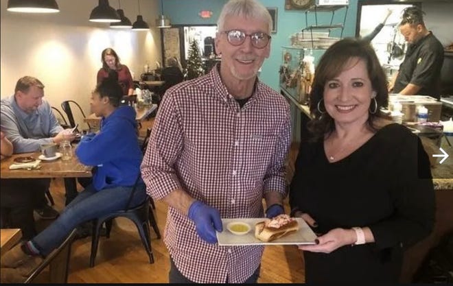 Denise Mehl, right, announced Sunday that she will close her restaurant, The Crepe Factory, at the end of the year. Here, she stands with Bobby Beauvais, former owner of Hub Diggity Dogs, in Dec. of 2019.