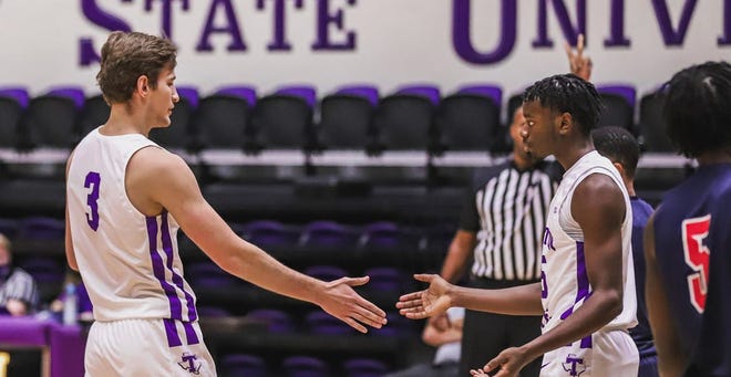 Tarleton's Konstantin Dotsenko and Shamir Bogues celebrate a call during a recent game. Texans head coach Billy Gillispie announced on Monday that the men's basketball program is pausing all team activities as a result of COVID-19 protocols.
