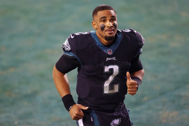 Philadelphia Eagles' quarterback Jalen Hurts (2) runs off the field after defeating the New Orleans Saints 24-21 in his first career start in an NFL football game, Sunday, Dec. 13, 2020, in Philadelphia. (AP Photo/Rich Schultz)