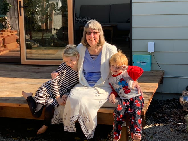 Todd Parsons' mother-in-law Marge with Parsons' two children in front of her ADU on the Parsons' property in Redwood City, California. The family bought the ADU from Abodu for about $200,000. It was installed this year.