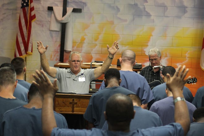 Inmates participate in worship as part of the St. Lucie County "Spiritual Learning" program