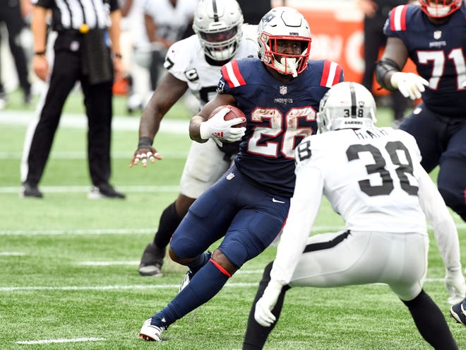 Patriots running back Sony Michel (middle) runs with the ball against Las Vegas Raiders strong safety Jeff Heath (front) during the fourth quarter at Gillette Stadium. Michel rushed for a season high 117 yards against the Raiders in September but has since gone on the IR and is taking a more diminished role as Damien Harris has taken over the RB1 duties. Mandatory Credit: Brian Fluharty-USA TODAY Sports, File