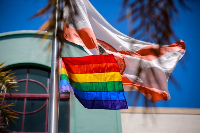 A gay pride flag is raised at City Hall in West Palm Beach in 2017.