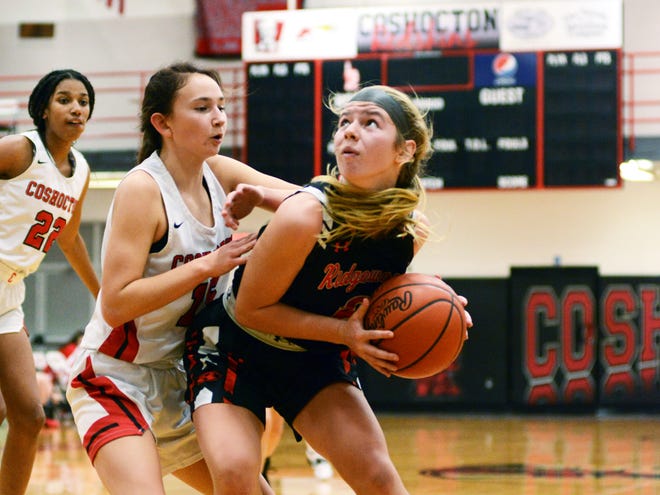 Coshocton's Isabelle Lauvray, left, guards Ridgewood's Kya Masloski in the post on Monday night at The Wigwam. Masloski and Lauvray are returning letter winners for their respective squads entering the upcoming season.