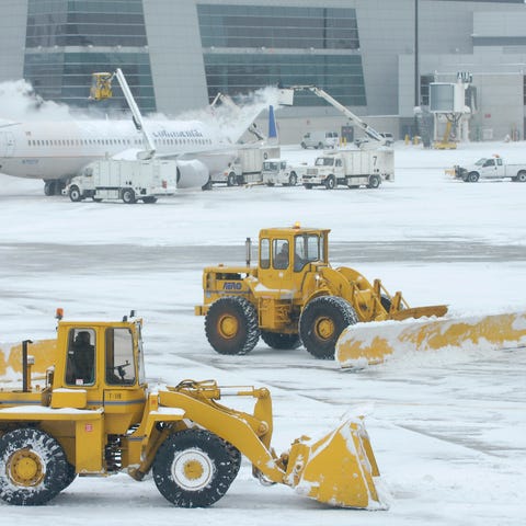 De-icing trucks and snow plows will be busy at air