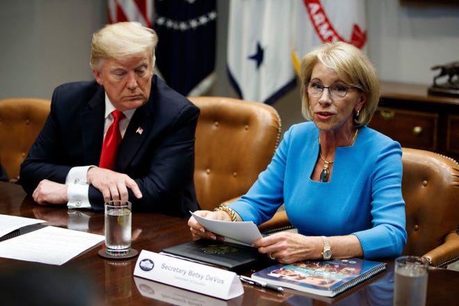 President Donald Trump and Secretary of Education Betsy DeVos.