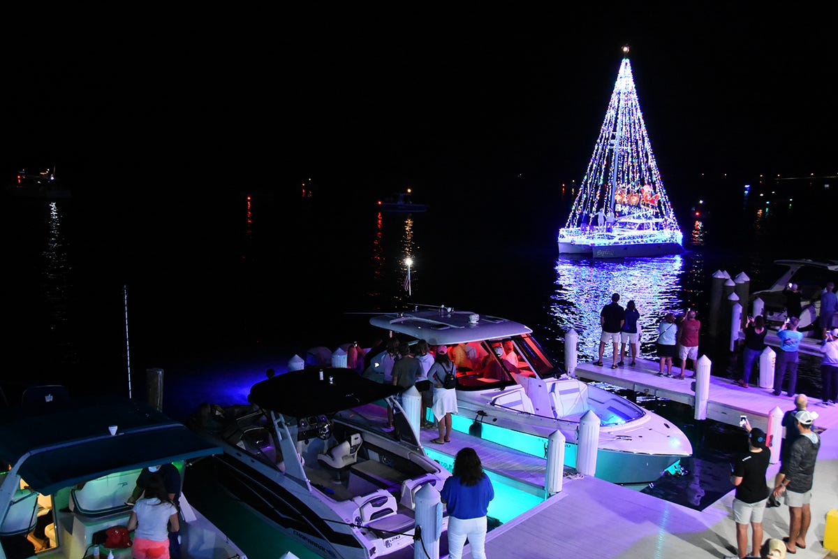 Colorful cavalcade Boat parade lights up the Marco River