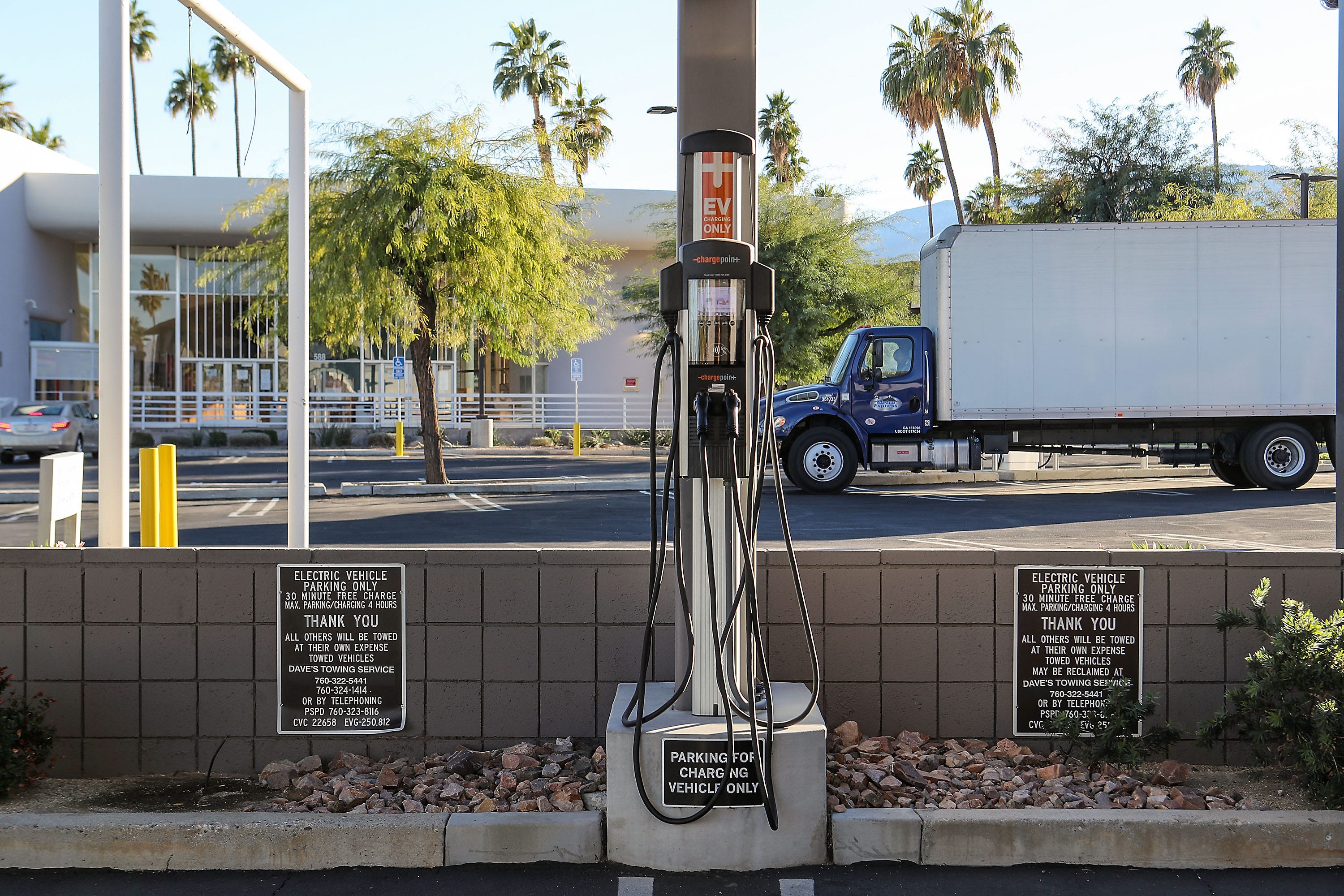 A no-cost charging station sits unused in a parking lot in downtown Palm Springs, Ca., December 15, 2020. 