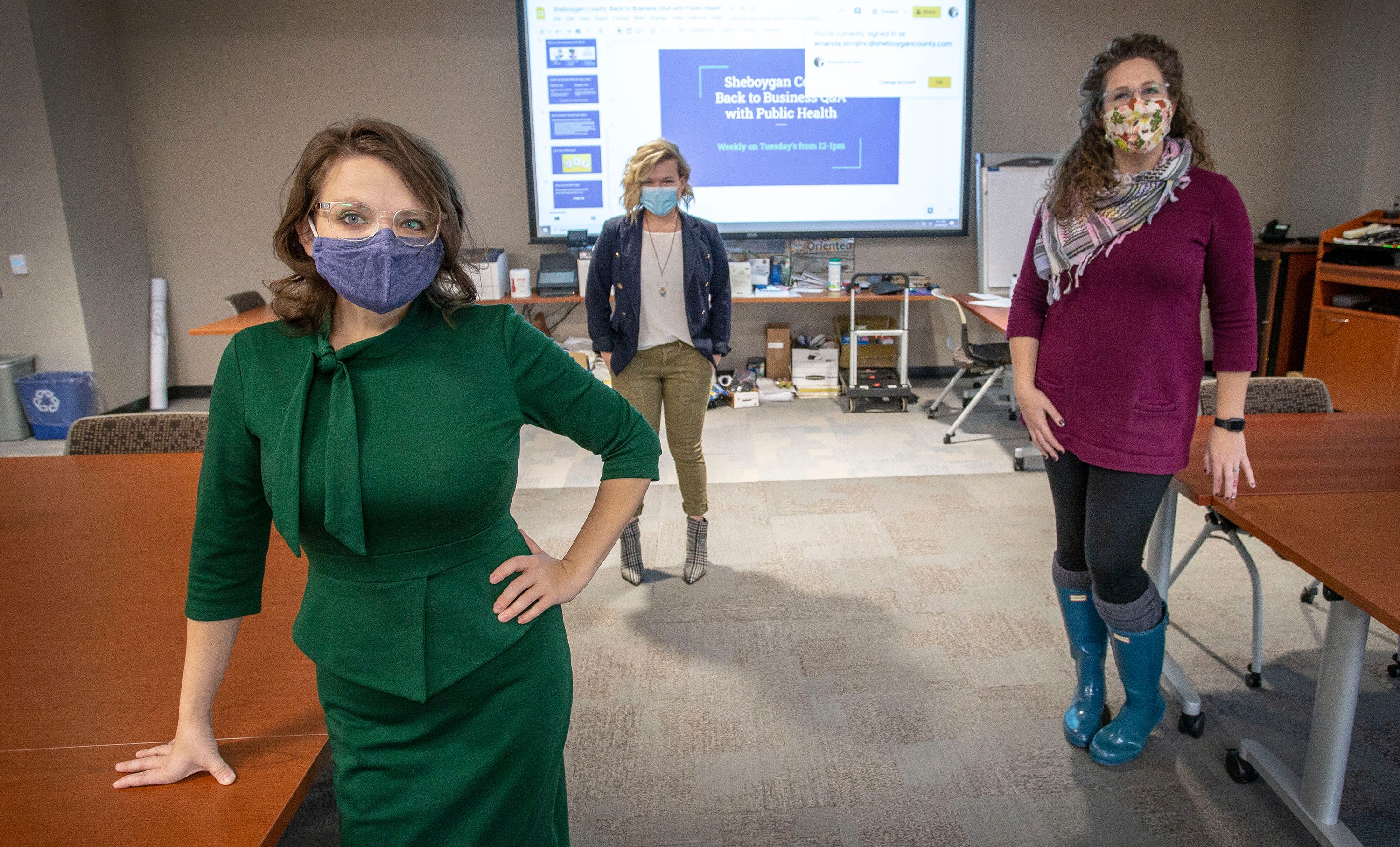 Leadership at the Sheboygan County Health and Human services include from left, Health Officer Starrlene Grossman, Lead Health Strategist Libby Jacobs, and Clinical Services Supervisor Amanda Strojinc pose in their main conference room,  Wednesday, December 16, 2020, in Sheboygan, Wis.  The three meet often in the room to help coordinate the county health efforts.