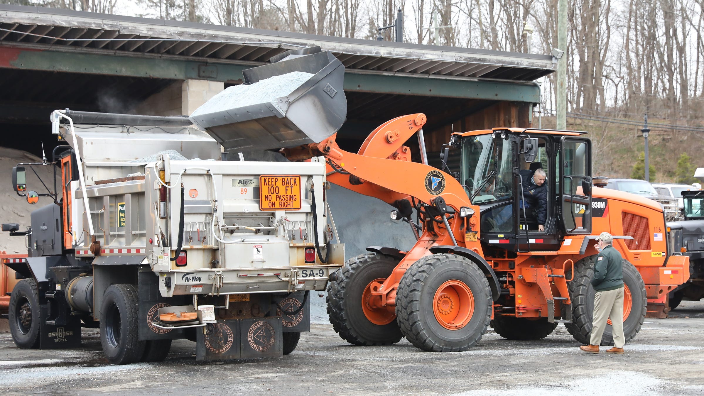 Rockland County Highway Dept. Superintendent Skip Vezzetti, right, talks with a heavy equipment operator as he loads the plaws with salt in preperation of the impending Nor'easter snowstorm at the Rockland County Highway Department facility in New City on Wednesday, December 16, 2020. 