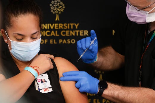 Crystal Molina, RN at University Medical Center of El Paso, is the first person in El Paso to receive the COVID-19 vaccine Tuesday Dec. 15, in El Paso. Over the next few days, it should receive about 2,900 doses of the vaccine, officials said.