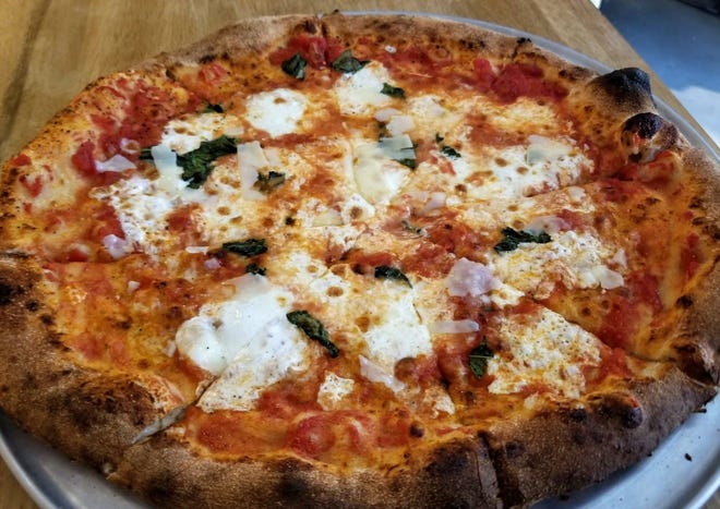 "The Franklin" features crushed California tomatoes, fresh mozzarella, basil leaves, reggiano, extra virgin olive oil and light pepper flakes.