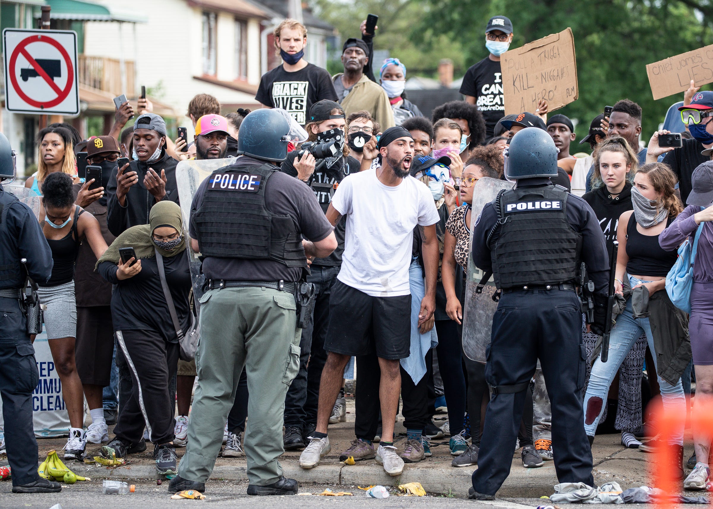 Protesters confronts Detroit police officers for the killing of Hakim Littleton on West McNichols Road at San Juan Drive in Detroit, Friday, July 10, 2020.