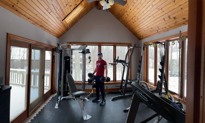 Scott Van Ornum works out in an exercise room that he and his wife, Shari, put in their Jackson home about eight years ago. The space is a sunroom, and they recently added an elliptical trainer.