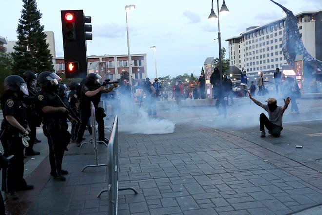 Police fire tear gas at protesters during the Black Lives Matter rally and civil unrest in Reno on May 30, 2020.