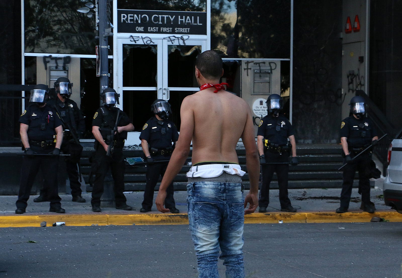 A man confronts the police in front of Reno City Hall during the Black Lives Matter rally and civil unrest in Reno on May 30, 2020.