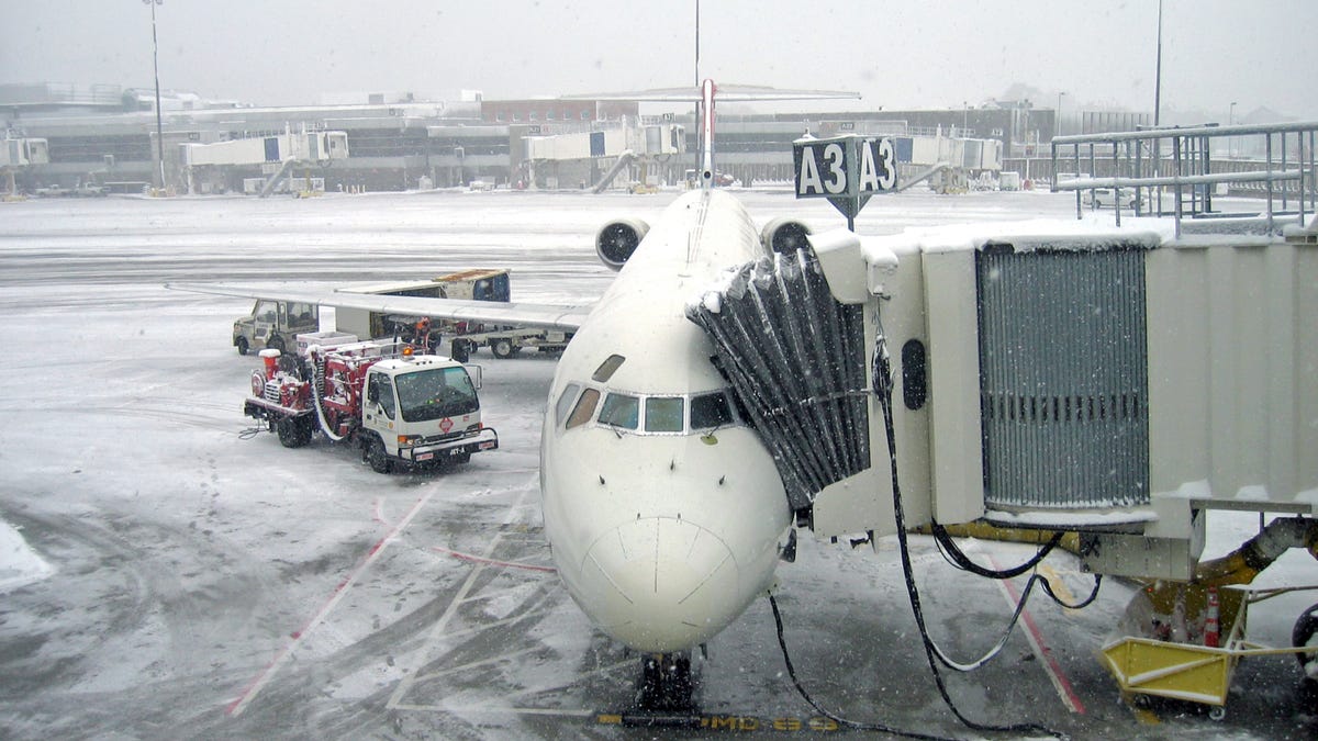There were over 100 canceled flights at Boston Logan International Airport Thursday after the region was blanketed in snow.