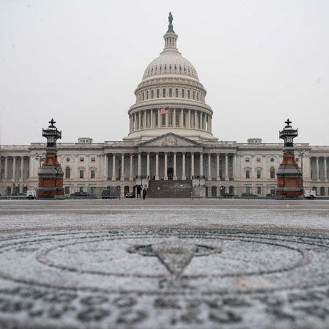 The US Capitol is seen as a snow storm develops in