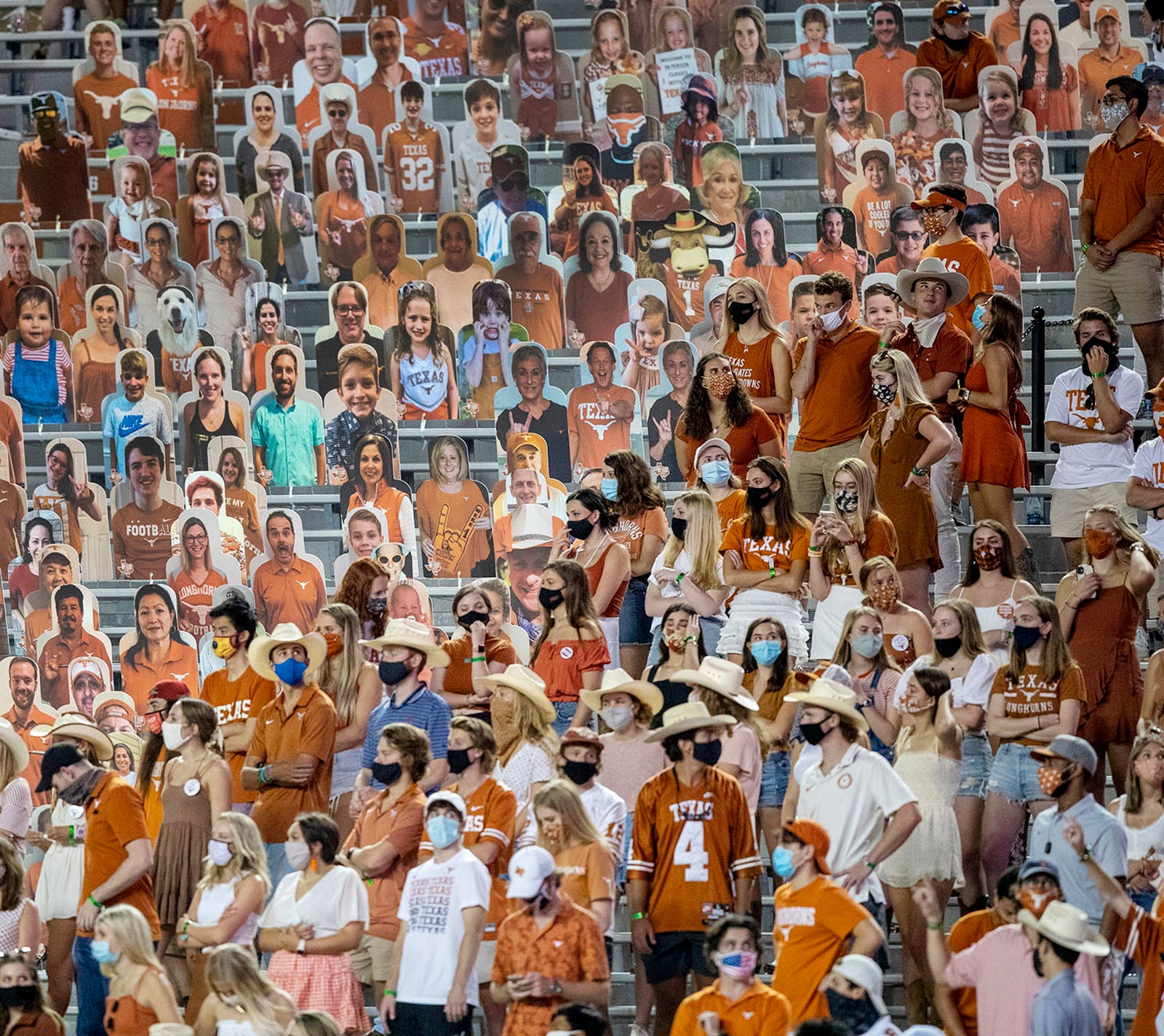 Cut out images of Texas Longhorns fans mixed with fans attending the game fill the lower level seats during Texas Longhorns against UTEP Miners NCAA football game in Austin, Texas on Saturday, Sept 12, 2020.