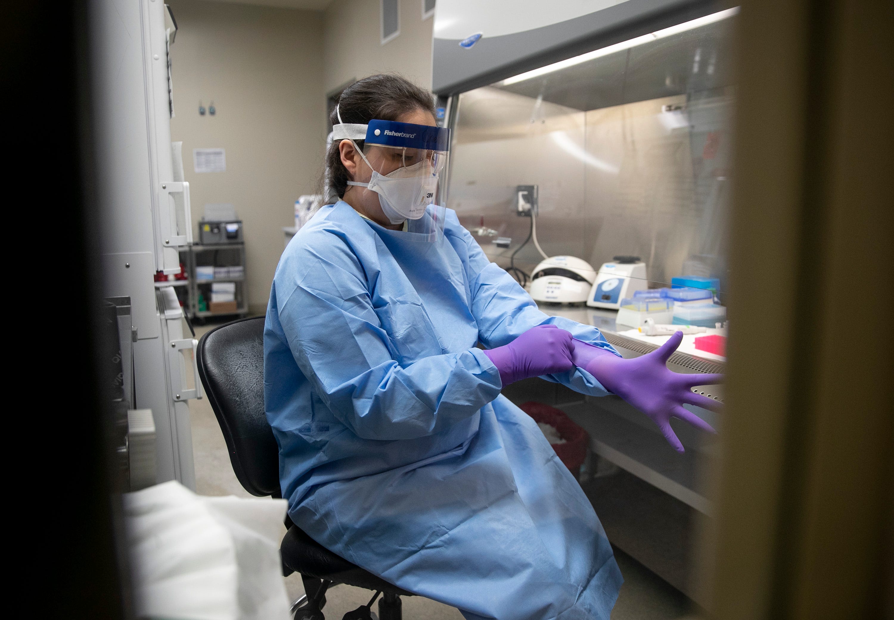 Microbiologist Chelsey Tiger tests samples for viruses in the virology lab at the Department of State Health Services Laboratory Building on Thursday March 5, 2020, where coronavirus tests will begin tomorrow.