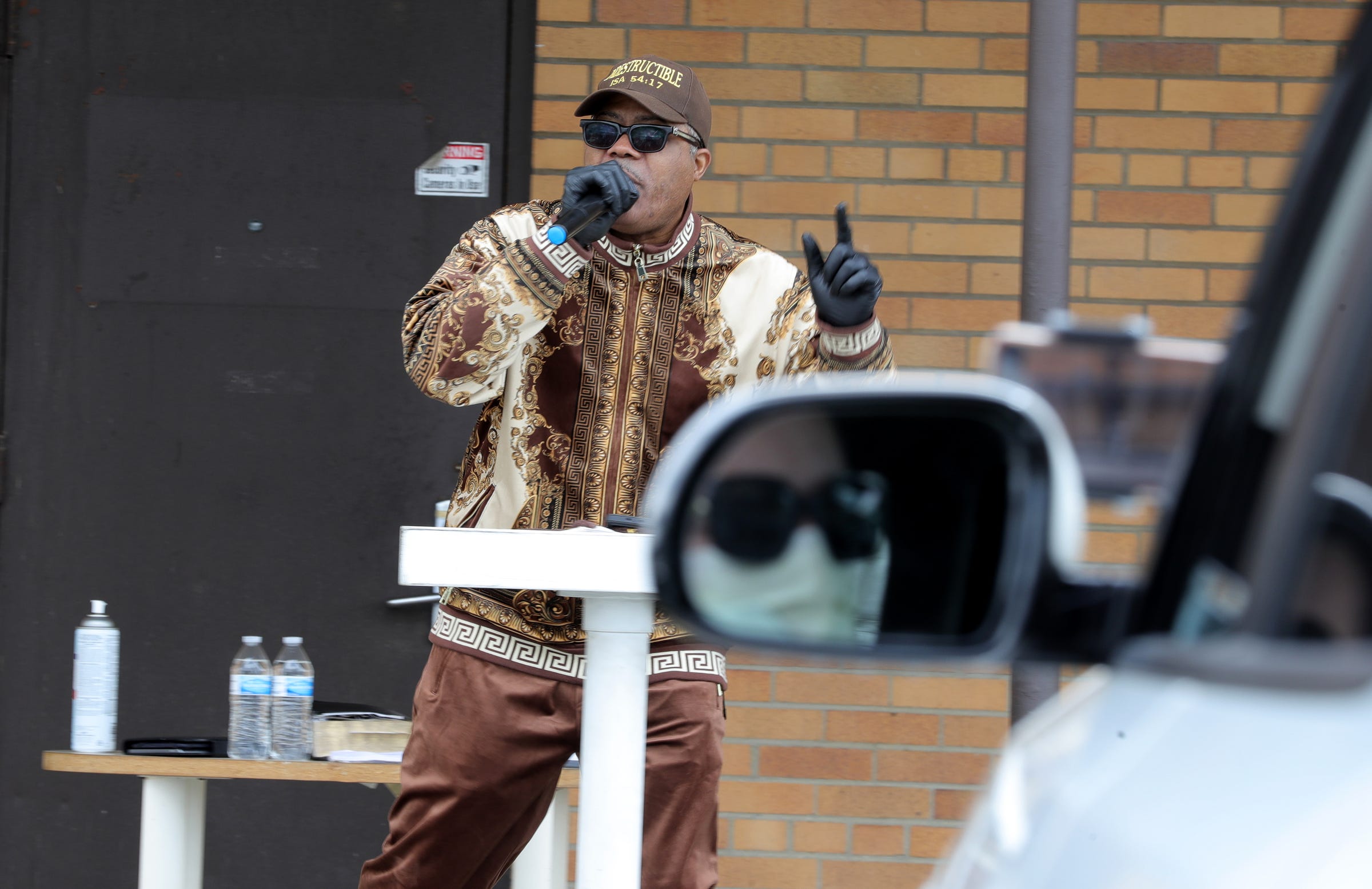 ll God's People Church Apostle W.J. Rideout conducted a drive-in service for his members to prevent the spread of the COVID-19 virus on Sunday, March 28, 2020 in Roseville. Church members stayed in their cars as Rideout gave his sermon in front of about 12 cars.