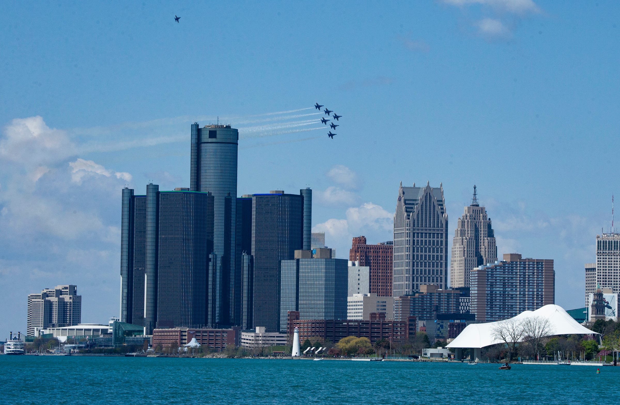 The U.S. Navy Blue Angels streak by against the Detroit skyline Tuesday, May 12, 2020 to pay tribute to frontline workers amid the Coronavirus outbreak.