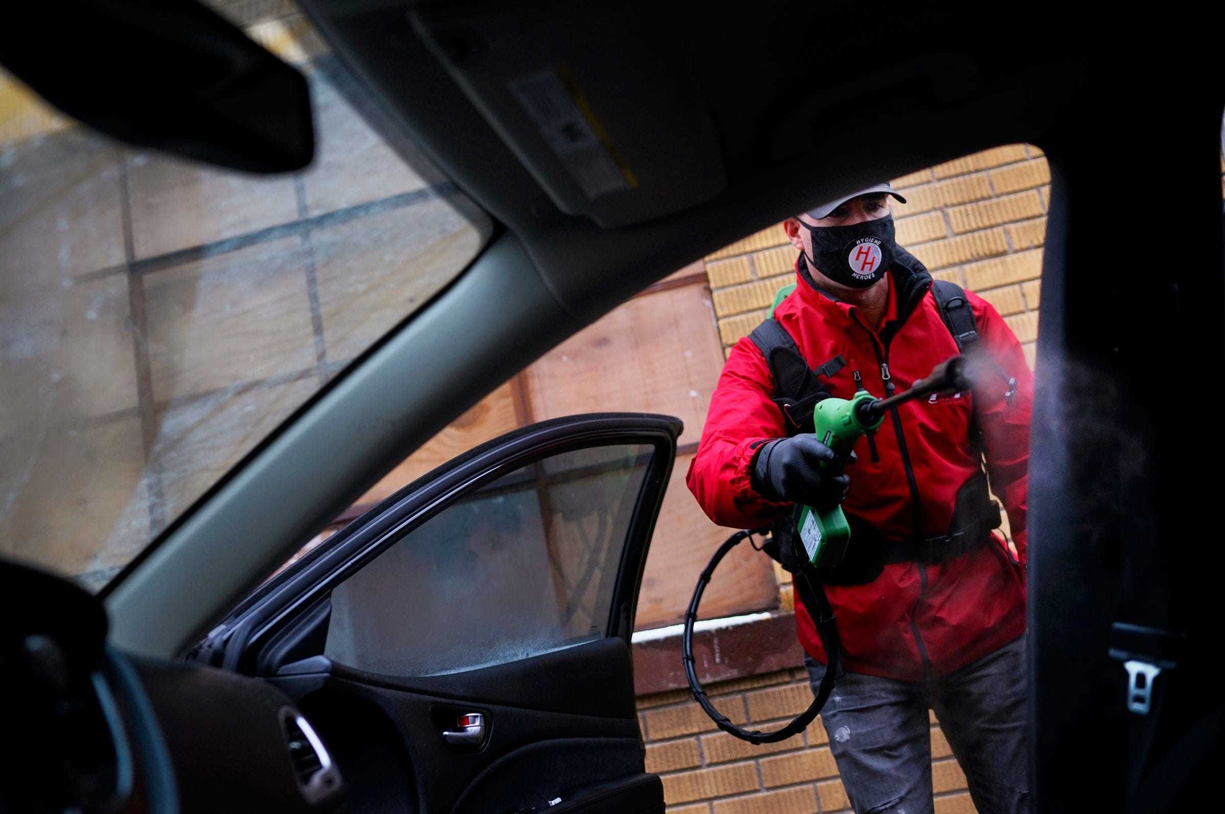 Joe Kulberg, director of operations at Enviro-Master Services, demonstrates their drive-thru sanitizing service on Tuesday, Dec. 1, 2020, in Warren. The service utilizes an EPA approved disinfectant with their "Virus Vaporizer" tool to sanitize cars. The service is available Monday through Friday, 10 a.m. to 2 p.m.