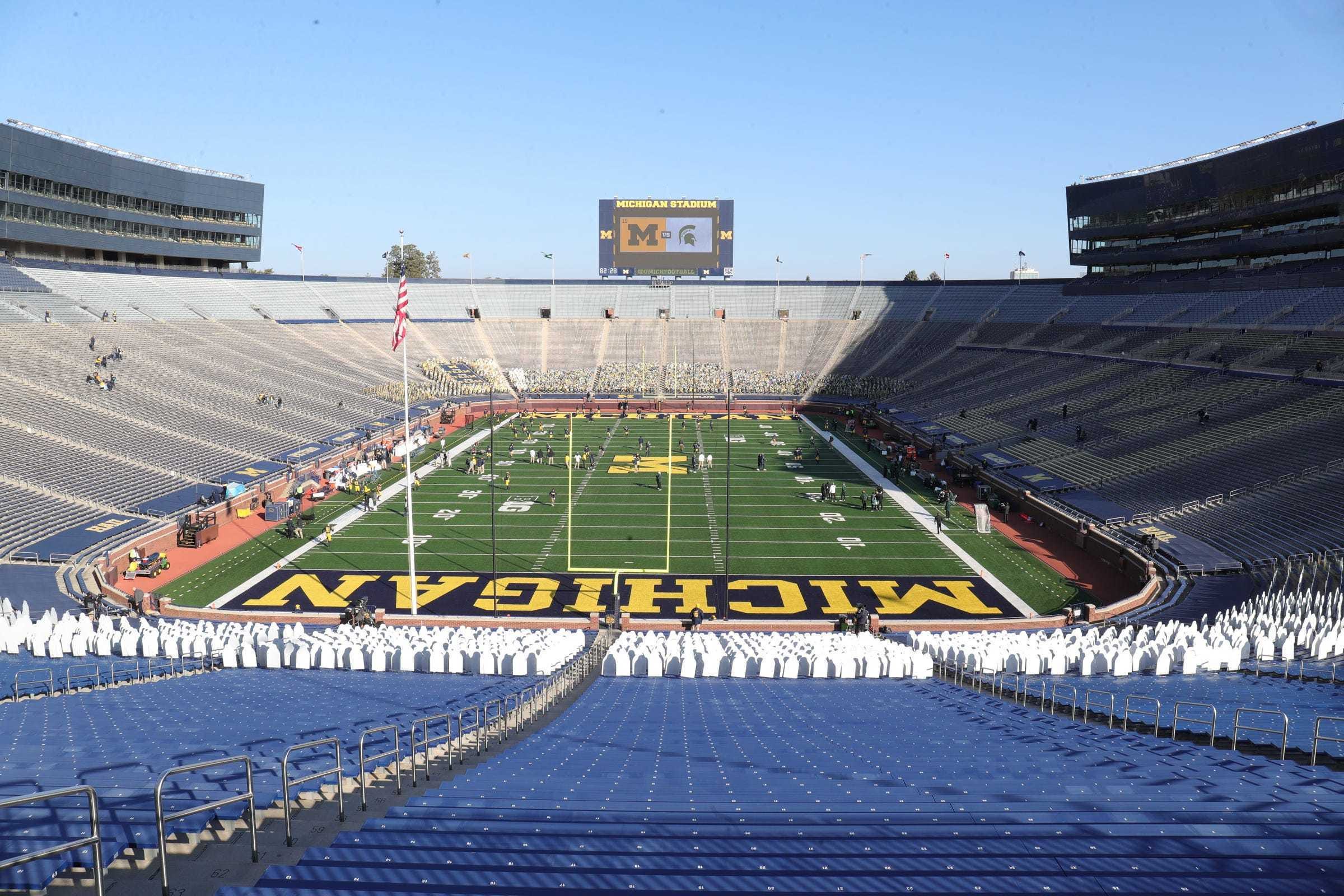 The Big House would normally be teeming with fans for one of the biggest rivalries in Big Ten football, but instead, an empty Michigan Stadium dotted with cardboard cutouts greets players before the Michigan State/Michigan game in Ann Arbor on October 31, 2020.