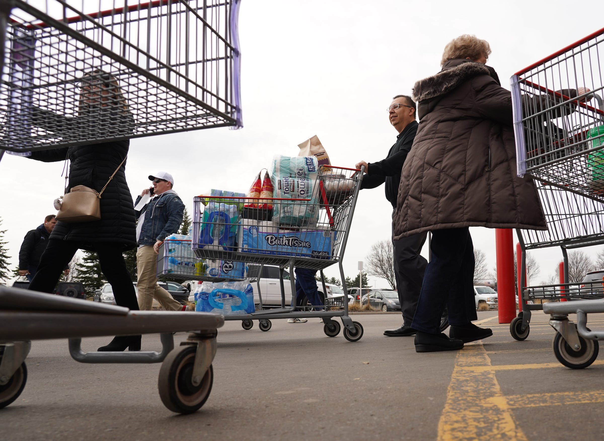 People grab supplies while shopping at Costco in Auburn Hills on Wednesday, March 11, 2020. Toilet paper, paper towels and disinfectants were in short supply during the early days of the coronavirus pandemic.
