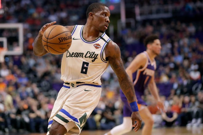 Milwaukee Bucks guard Eric Bledsoe (6) looks to pass during the second half of an NBA basketball game against the Phoenix Suns Sunday, March 8, 2020, in Phoenix. (AP Photo/Matt York) ORG XMIT: AZMY10