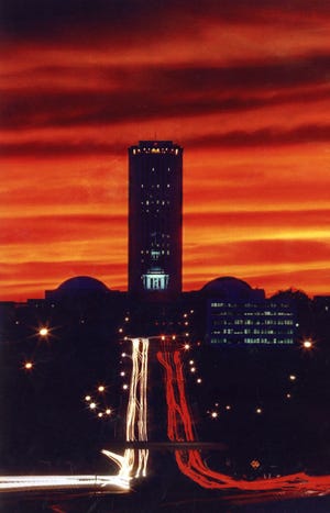 The Florida Capitol, caught in a time-lapse photo, with Apalachee Parkway traffic at night. (Mike Ewen/Democrat files)