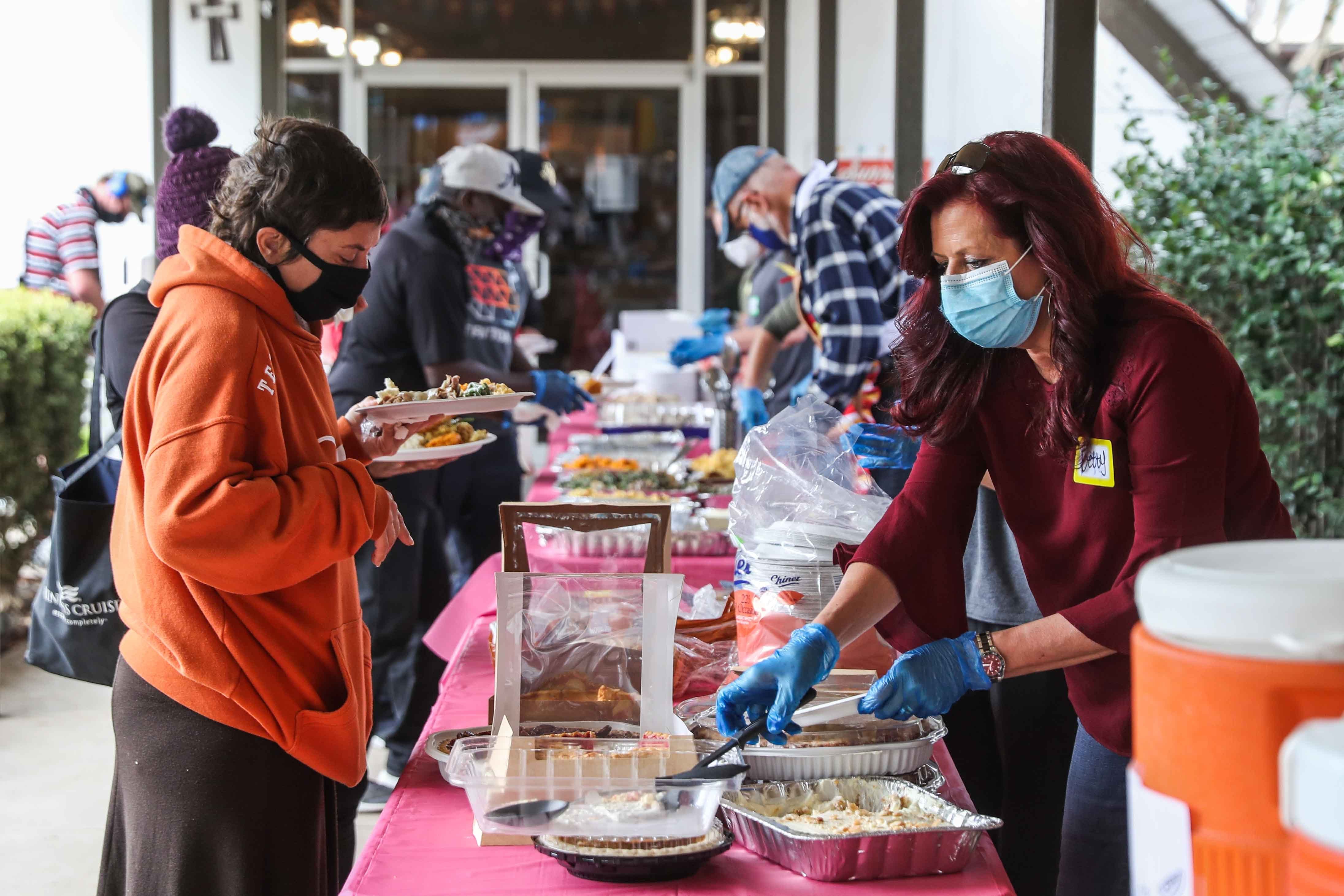 Sunrise Community Church serves Thanksgiving meals to those experiencing homelessness in Austin on Thursday, November 26, 2020.