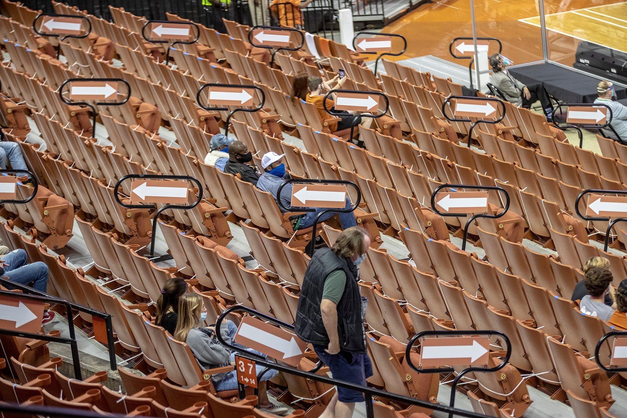 Texas Longhorns fans make their way to their seat to watch Texas Longhorns against University of Texas Rio Grande Valley of a NCAA basketball game at the Frank Erwin Center, Wednesday November 25, 2020.