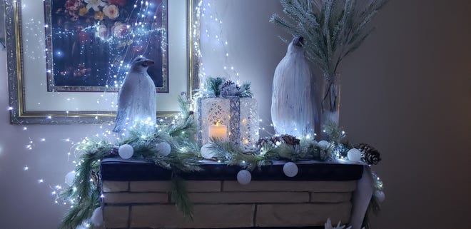 Penguins sit atop the mantel inside Walker's formal living area.