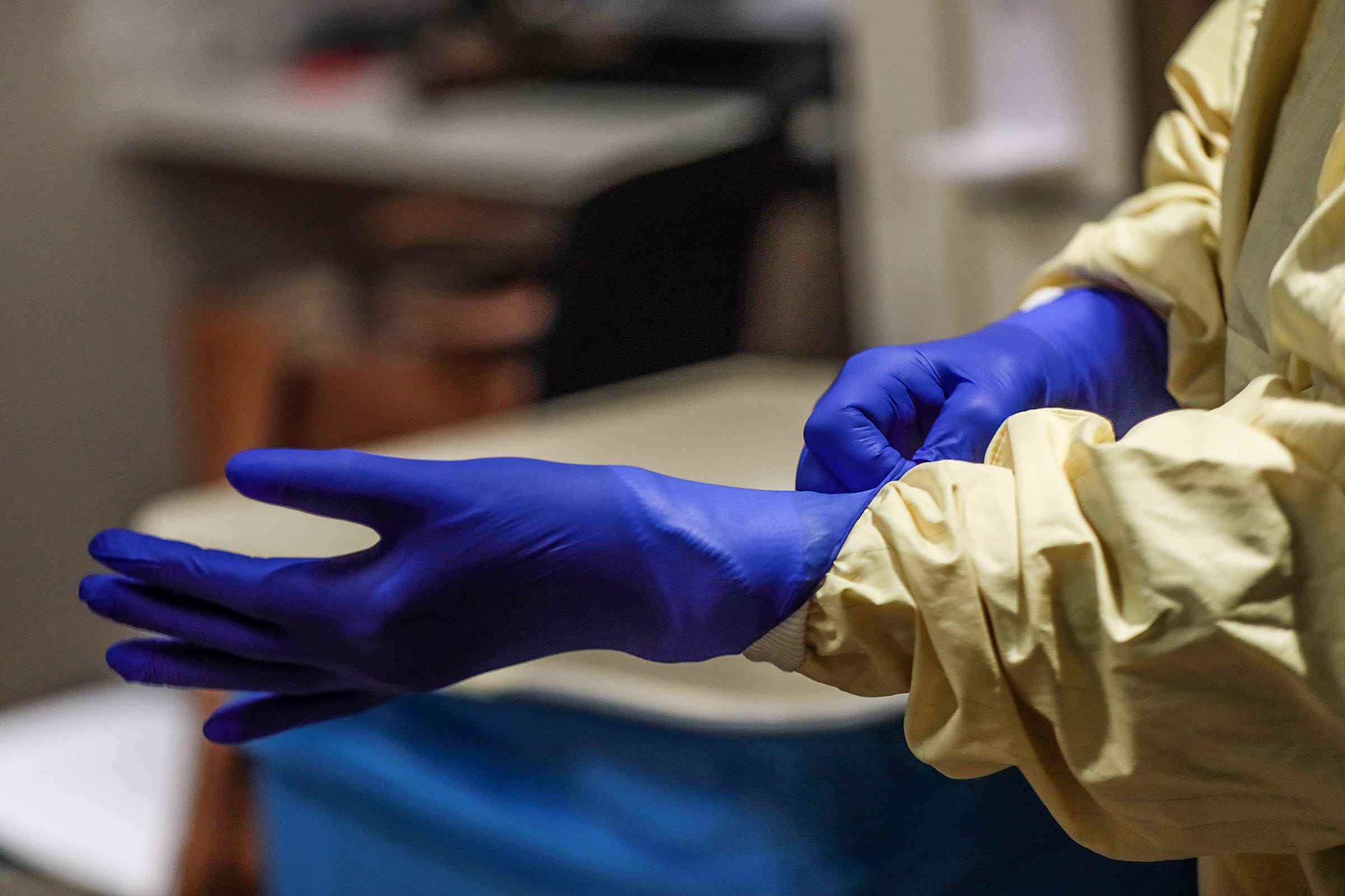 Donning and doffing are a key practice that has been improved since the beginning of the spread of COVID-19 coronavirus with carts and gloves in front of each COVID-19 patient's room at Beaumont Hospital in Farmington Hills, Mich. on Dec. , 2020.