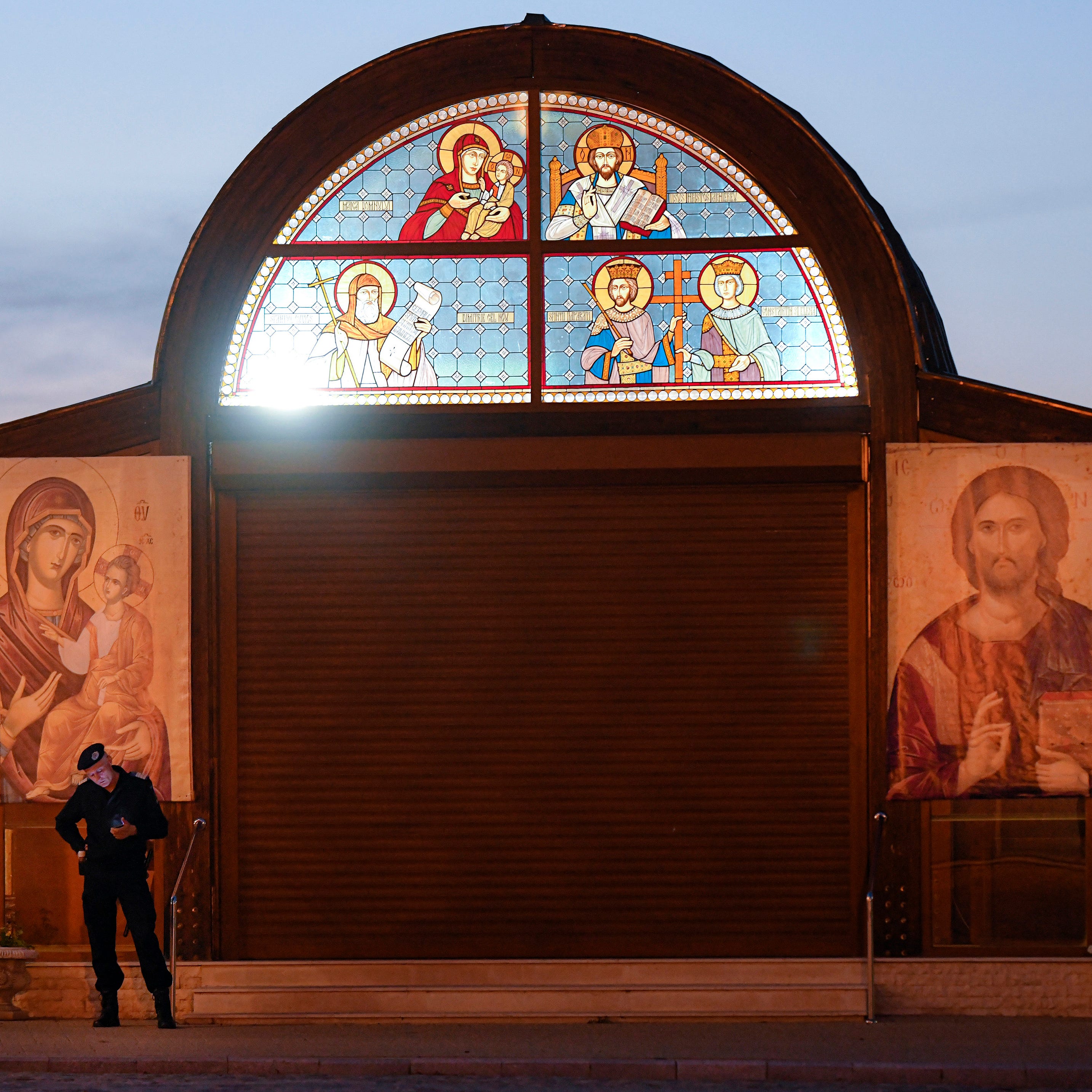 A Romanian gendarme stands during the Orthodox Good Friday religious service outside the Patriarchal Orthodox Cathedral in Bucharest, Romania, Friday, April 17, 2020.