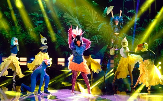 Exotic Bird, center, performs with a flock of backup dancers on Fox's "The Masked Dancer," a spinoff of "The Masked Singer."